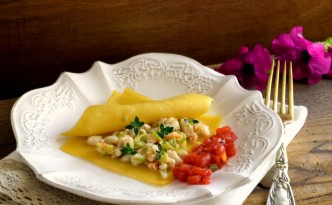 Raviolo aperto di pasta fresca con persce di lago